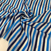 Pure silk crêpe de chine with stripe design in the shades of white, dark blue, light blue and turquoise. Very soft and light, flowy and not transparent. Ideal for dresses, skirts, blouses, and shirting. High-quality deadstock collected in Stock from a Maison de Couture in Italy.