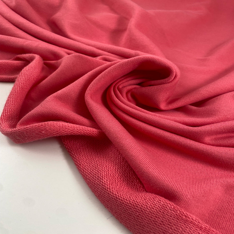 Pure cotton sweatshirt in pink color reference Strawberry Pink. Very soft and light, ideal for trousers, sweatshirts, dresses, and skirts. High-quality deadstock collected in Stock from a Maison de Couture in Italy.