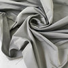 Polyester and silk taffeta in gray color reference drizzle. Stiff and voluminous, ideal for shirting, dresses, skirts, and jackets. High-quality deadstock collected in Stock from a Maison de Couture in Italy.