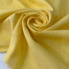 Pure cotton in sun struck yellow, slightly heavy with a rough, linen-like texture. Perfect for dresses, jackets, or skirts. High-quality deadstock collected in Stock from a Maison de Couture in Italy.
