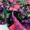 Polyester twill with beautiful flower design. The ground is black and the shades of the flowers are violet, hot pink an,d green. Very soft, light, and flowy. High-quality deadstock fabric by the meter collected in Stock from a Maison de Couture in Italy.