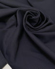 Structured heavy jersey with a refined gabardine texture. Soft yet durable, perfect for trousers, jackets, skirts, and dresses.High-quality deadstock collected in Stock from a Maison de Couture in Italy.