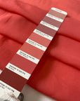 Light and soft viscose georgette in a coral shade. Slightly transparent with an elegant drape, perfect for skirts, blouses, shirting, and dresses. High-quality deadstock collected in Stock from a Maison de Couture in Italy.