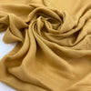 Soft pure viscose in spicy mustard color. Flowy and light, ideal for dresses, blouses and skirts. High-quality deadstock fabric by the meter collected in Stock from a Maison de Couture in Italy.