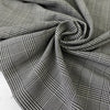 Soft stretch wool with a classic Prince of Wales design in black and white. Perfect for trousers, dresses, skirts, and jackets.High-quality deadstock collected in Stock from a Maison de Couture in Italy.