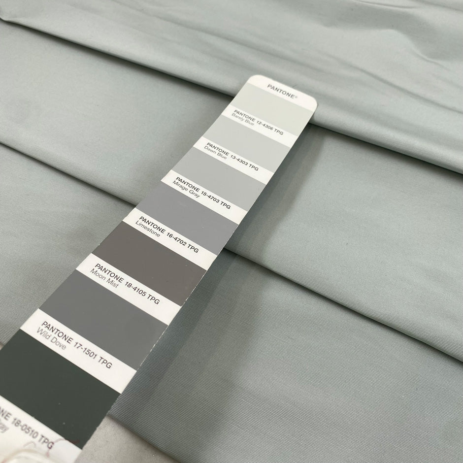 Cotton and polyester taffeta in Mirage Gray with a textured finish. Slightly stiff and shape-retaining, ideal for jackets, skirts, and dresses. High-quality deadstock collected in Stock from a Maison de Couture in Italy.