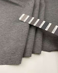 Milano stitch of soft and compact viscose-polyamide blend with grey melange weave. High quality deadstock fabric.