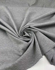 Milano stitch of soft and compact viscose-polyamide blend with grey melange weave. High quality deadstock fabric.