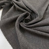 Blended wool and polyester in light gray melange. Very soft and lightweight, not transparent. Ideal for dresses, light jackets, skirts, and trousers. High-quality deadstock collected in Stock from a Maison de Couture in Italy.