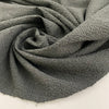 Light gray polyester seersucker with a crisp, puckered texture. Perfect for airy, wrinkle-resistant garments. High-quality deadstock collected in Stock from a Maison de Couture in Italy.