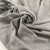 Stretch fabric with textured surface in light gray color reference Quiet Gray. Very soft and light, ideal for t-shirts and dresses. High-quality deadstock collected in Stock from a Maison de Couture in Italy.