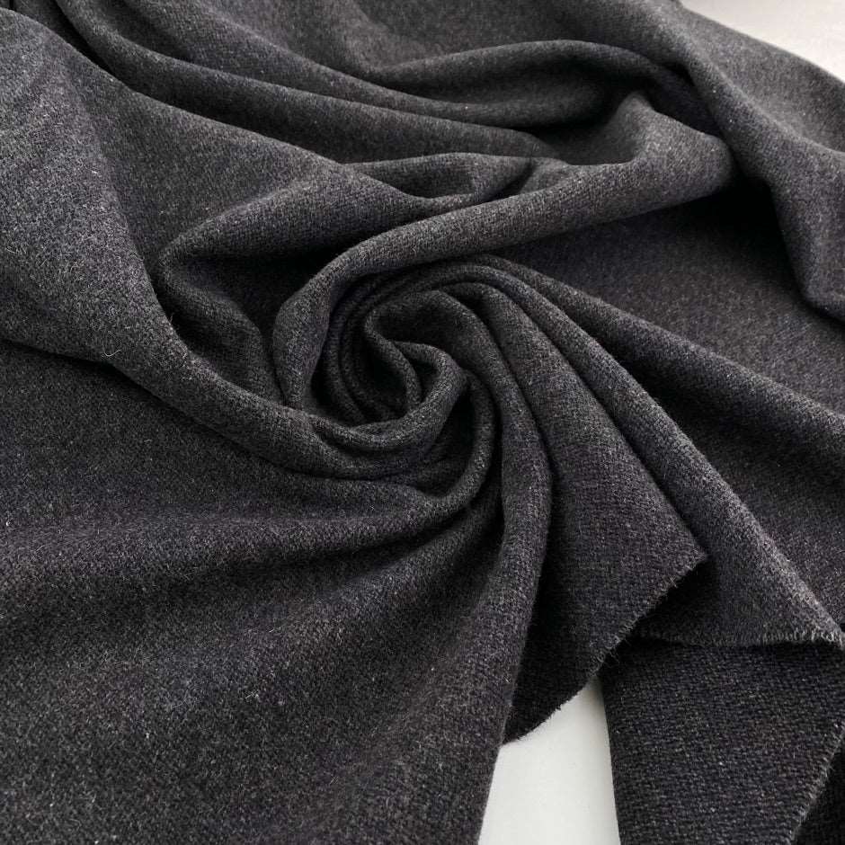 Grey yarn-dyed structured wool flannel. High quality deadstock fabric collected in Stock from a Maison de Couture in Italy.