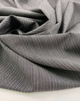 Gray and white stretch wool pinstripes. High quality deadstock fabric.