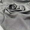 Prince of wales of pure soft wool with bordeaux row. High-quality deadstock fabric collected in Stock from a Maison de Couture in Italy.