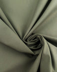 Green bielastic cotton gabardine, ideal for trousers. High-quality deadstock collected in Stock from a Maison de Couture in Italy.