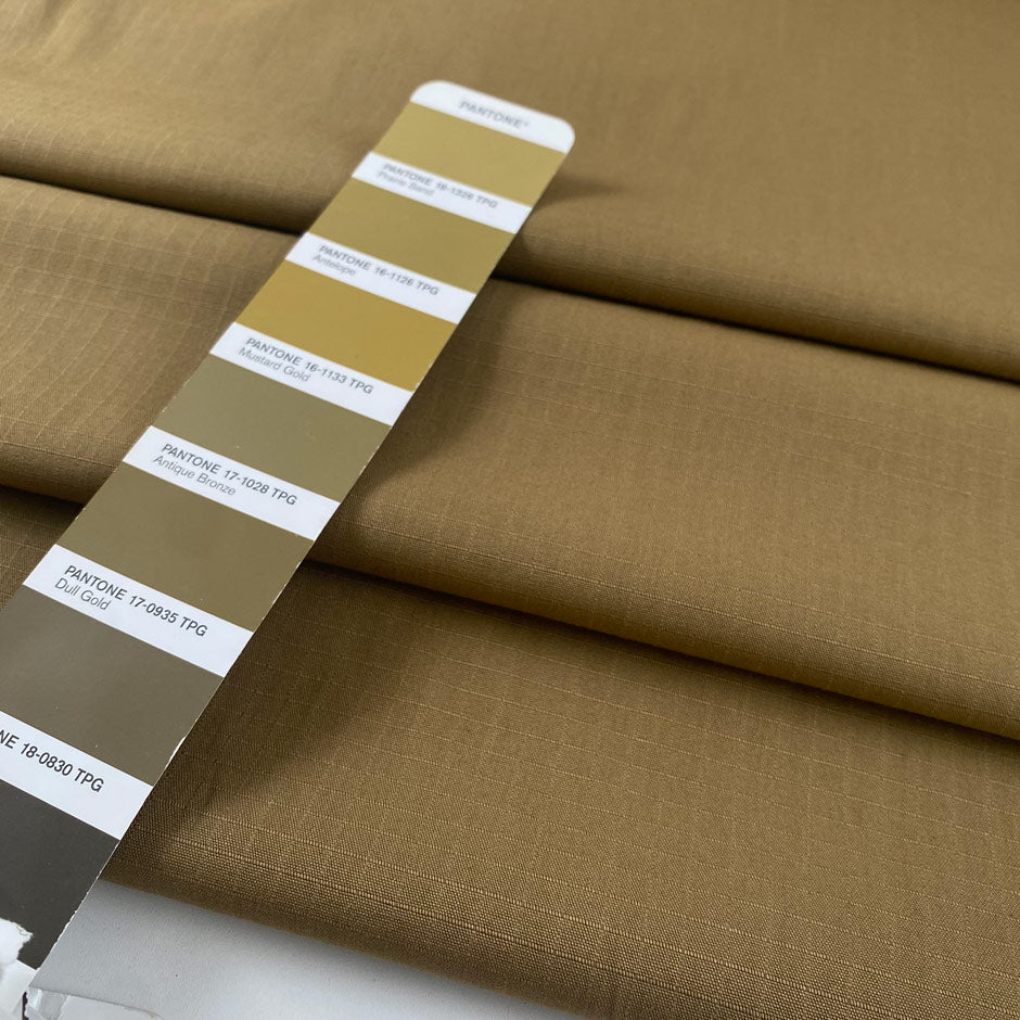 Durable olive green cotton ripstop with a textured grid weave ideal for utility garments outerwear and accessories. High-quality deadstock collected in Stock from a Maison de Couture in Italy.