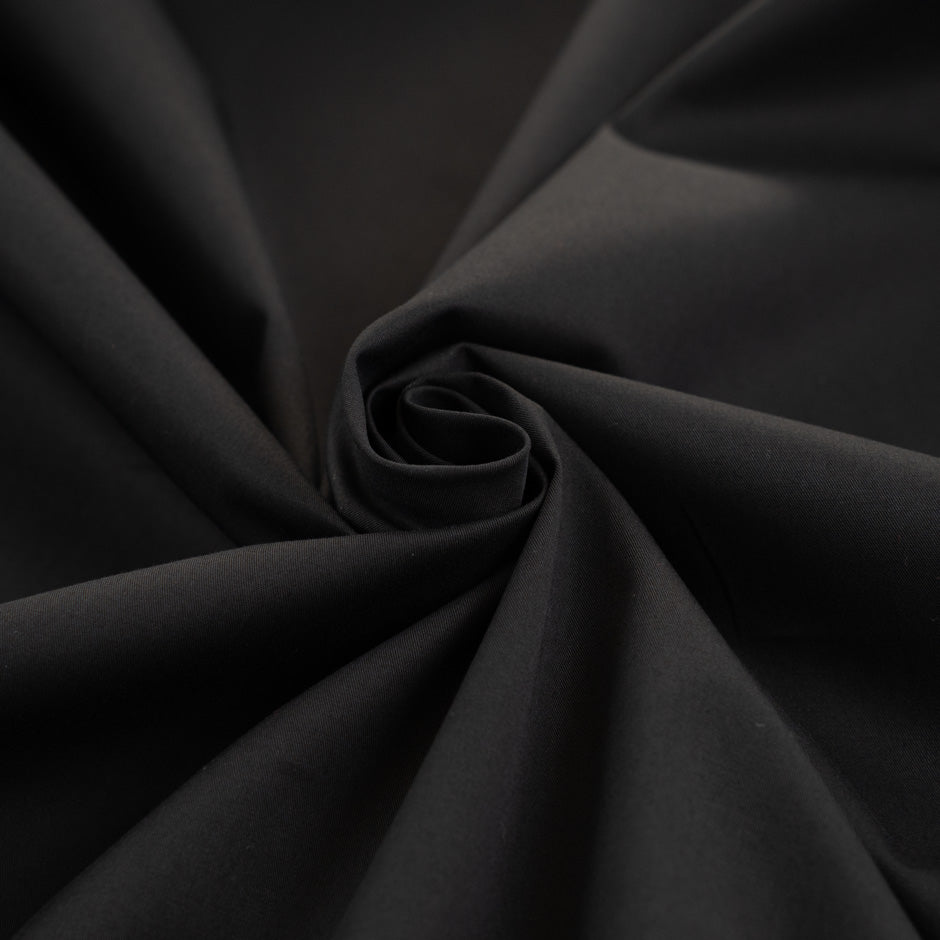 Stretched and textured plain black cotton fabric - High quality deadstock