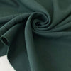 Soft and flowing wool and viscose stretch double crêpe in dark green. Perfect for jackets, skirts, and dresses.High-quality deadstock collected in Stock from a Maison de Couture in Italy.