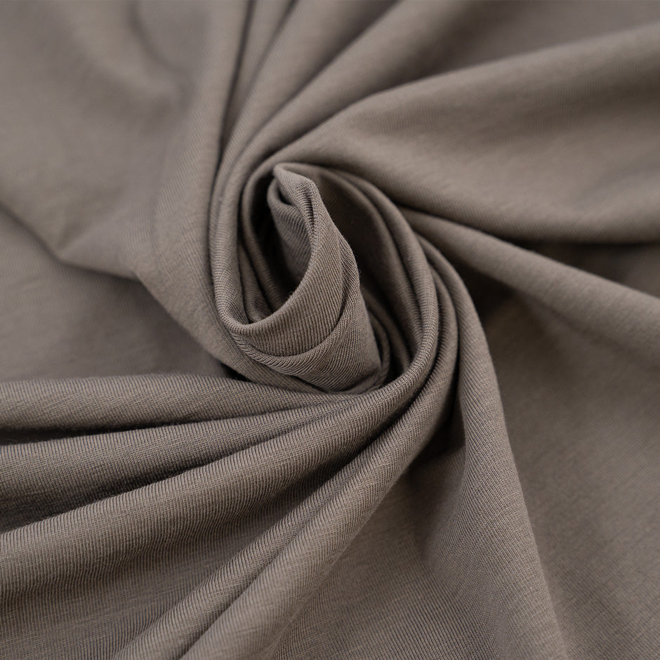 Clay-colored cotton jersey and stretchy. High-quality deadstock fabric collected in Stock from a Maison de Couture in Italy.