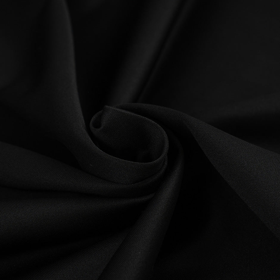 Black cotton polyester jersey, stretch and falling. High-quality deadstock fabric collected in Stock from a Maison de Couture in Italy.