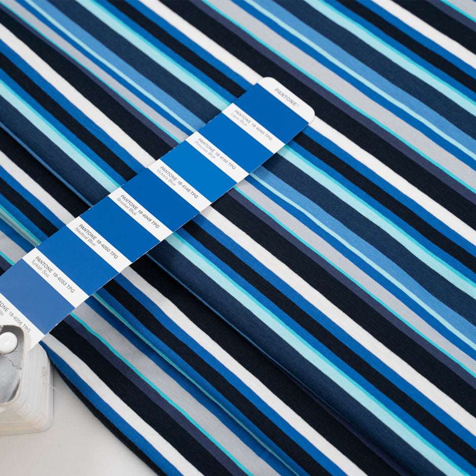 Cotton jersey with blue and white stripes blue background, soft and stretchy. Deadstock fabric picked up from a Maison de Couture in Italy.