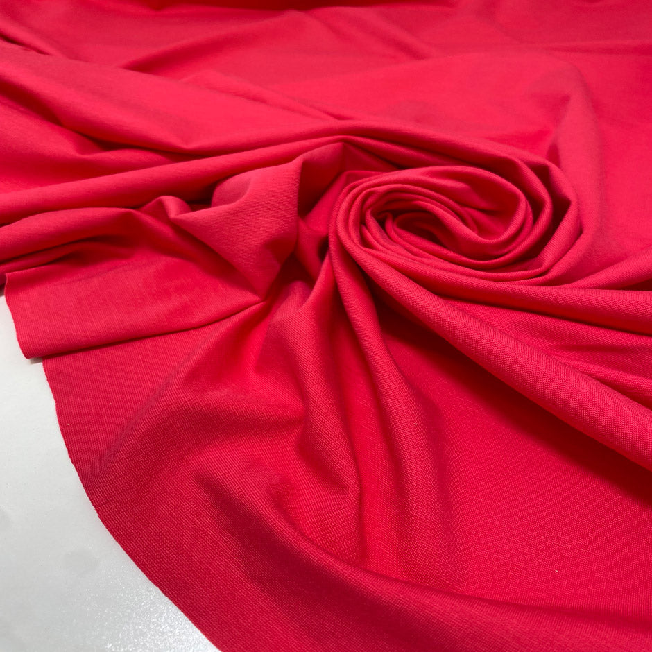 Soft and stretchy viscose and elastane blend in hot pink. Comfortable and versatile, ideal for trousers, dresses, light jackets, and skirts.&nbsp;High-quality deadstock collected in Stock from a Maison de Couture in Italy.