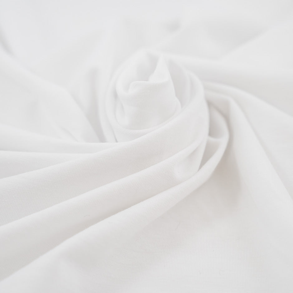 White and stretched cotton jersey. High-quality deadstock fabric collected in Stock from a Maison de Couture in Italy.