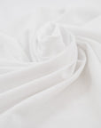 White and stretched cotton jersey. High-quality deadstock fabric collected in Stock from a Maison de Couture in Italy.