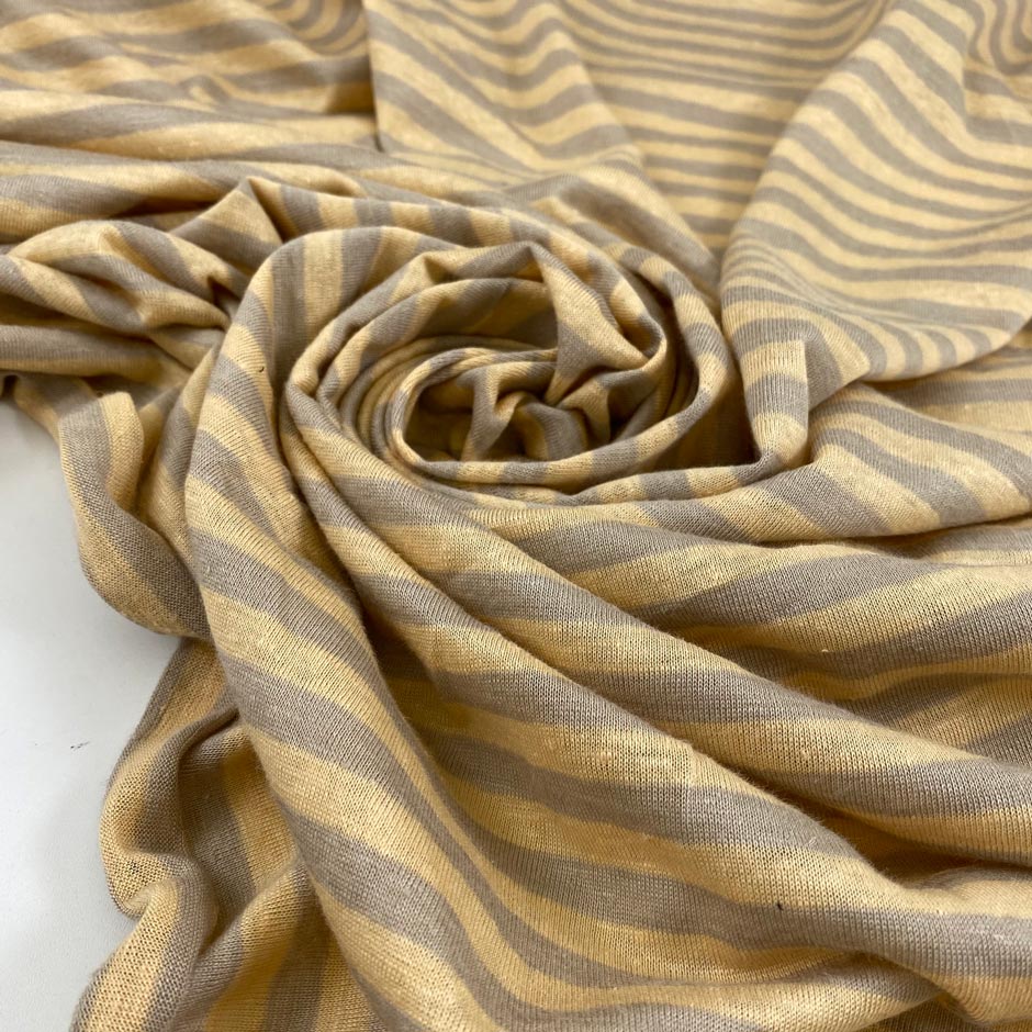 Pure line jersey with stripes design in pale banana yellow and gray. Very soft, light and flowy. High-quality deadstock fabric collected in Stock from a Maison de Couture in Italy.