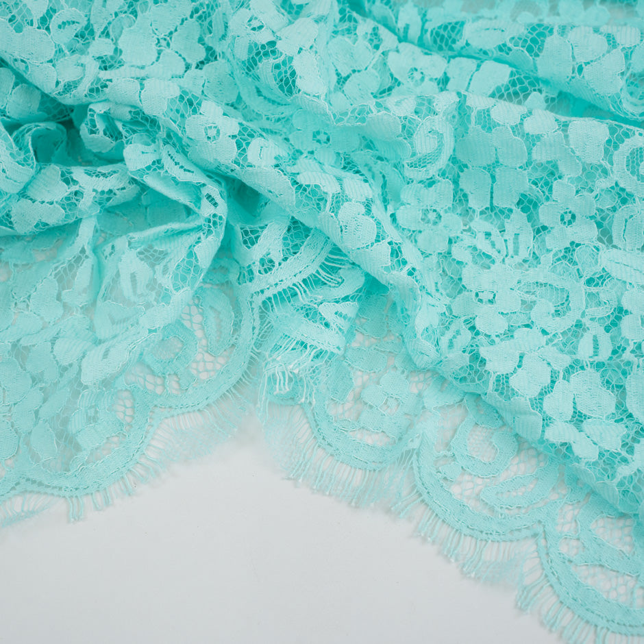 Light blue water lace polyamide and viscose. Transparent and falling. High-quality deadstock fabric collected in Stock from a Maison de Couture in Italy.