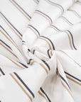 Shadow striped white cotton polin with black and beige stripes. High quality deadstock fabric.