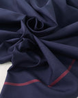 Blue cotton fabric with a distinctive red selvage line soft and breathable ideal for shirts dresses and refined details. High-quality deadstock collected in Stock from a Maison de Couture in Italy.