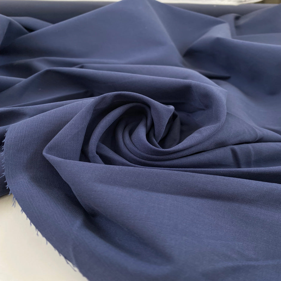 Pure cotton fabric in blue, very thick and stiff with a dry handfeel, ideal for structured garments, jackets, and utility pieces. High-quality deadstock collected in Stock from a Maison de Couture in Italy.