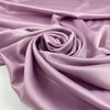Lilac matte polyester satin with a soft hand and elegant drape, perfect for dresses, linings, and fluid pieces. High-quality deadstock collected in Stock from a Maison de Couture in Italy.