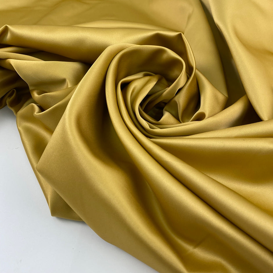 Polyester satin very soft and light, shiny in solid color. High-quality deadstock fabric collected in Stock from a Maison de Couture in Italy.