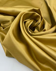 Polyester satin very soft and light, shiny in solid color. High-quality deadstock fabric collected in Stock from a Maison de Couture in Italy.