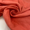 Linen and cotton in coral pink very soft and flowy. High-quality deadstock fabric collected in Stock from a Maison de Couture in Italy.