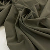 Stretch cotton cady in mud color, very soft and flowy, ideal for dresses, trousers, and elegant separates. High-quality deadstock collected in Stock from a Maison de Couture in Italy.