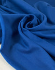Warm cotton sweatshirt fabric in galaxy blue, very soft and medium weight. Ideal for trousers, sweatshirts, and jackets. High-quality deadstock collected in Stock from a Maison de Couture in Italy.