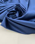 Solid blue gray polyester satin. High quality deadstock fabric picked up in Stock from a Maison de Couture in Italy.