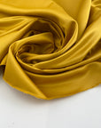 Yellow polyester satin.