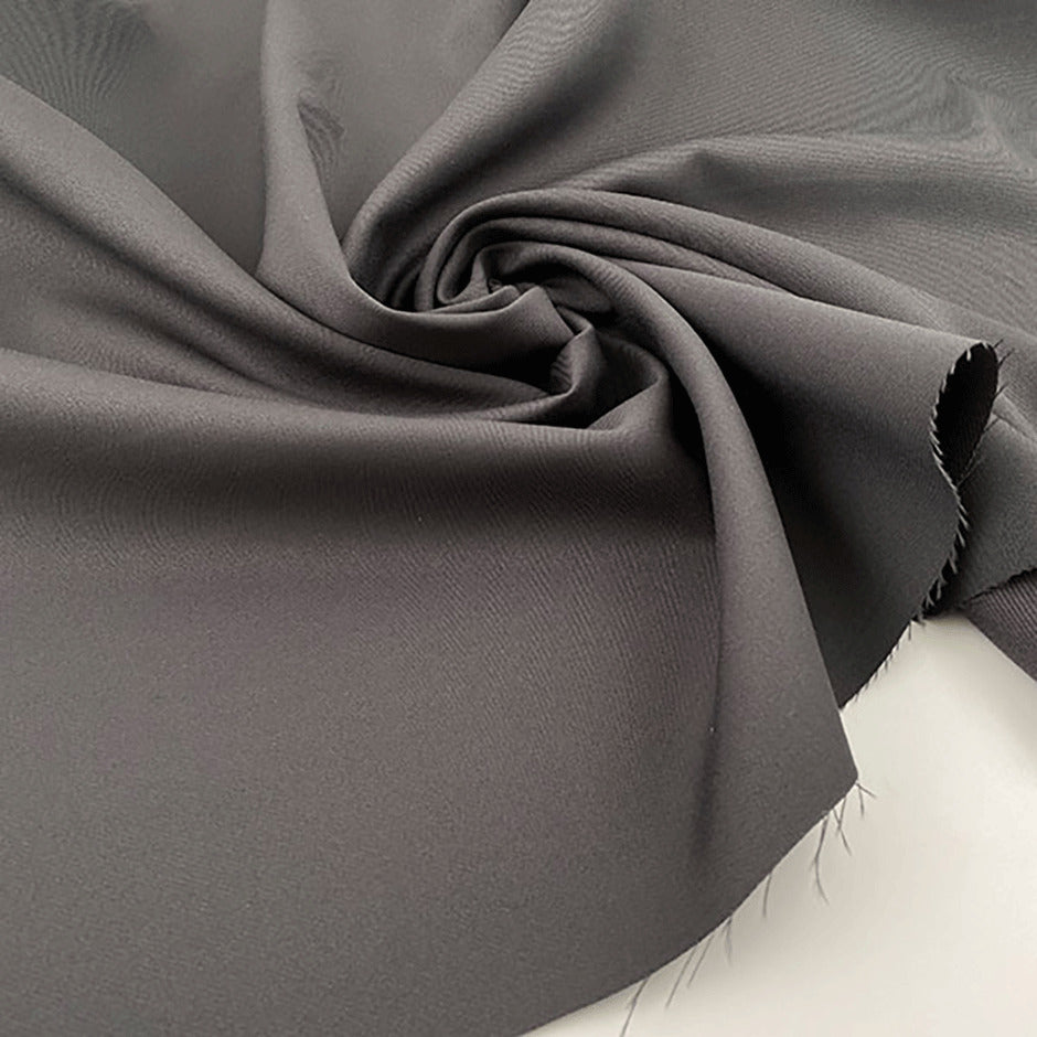 Technical polyester fabric with gabardine weave