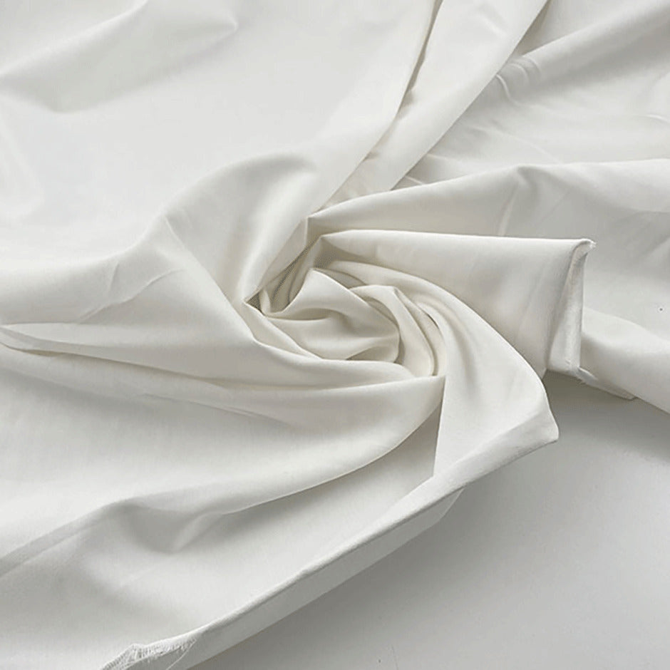 Irregularly textured soft lightweight plain cotton muslin