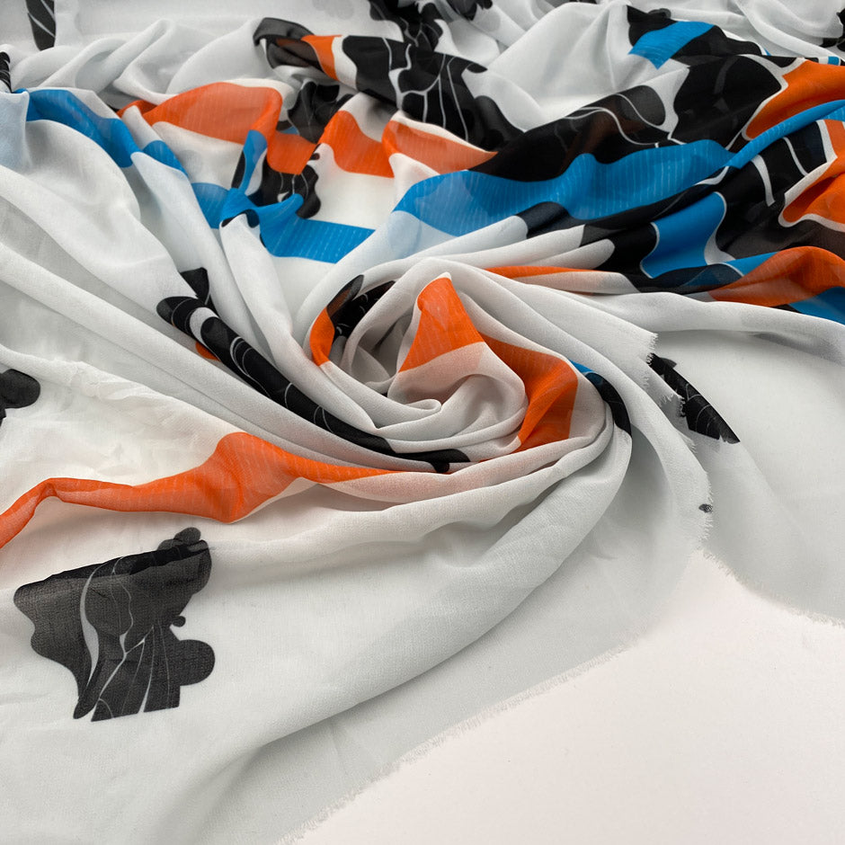 Printed polyester voile worked with soft transparent fluid crepe