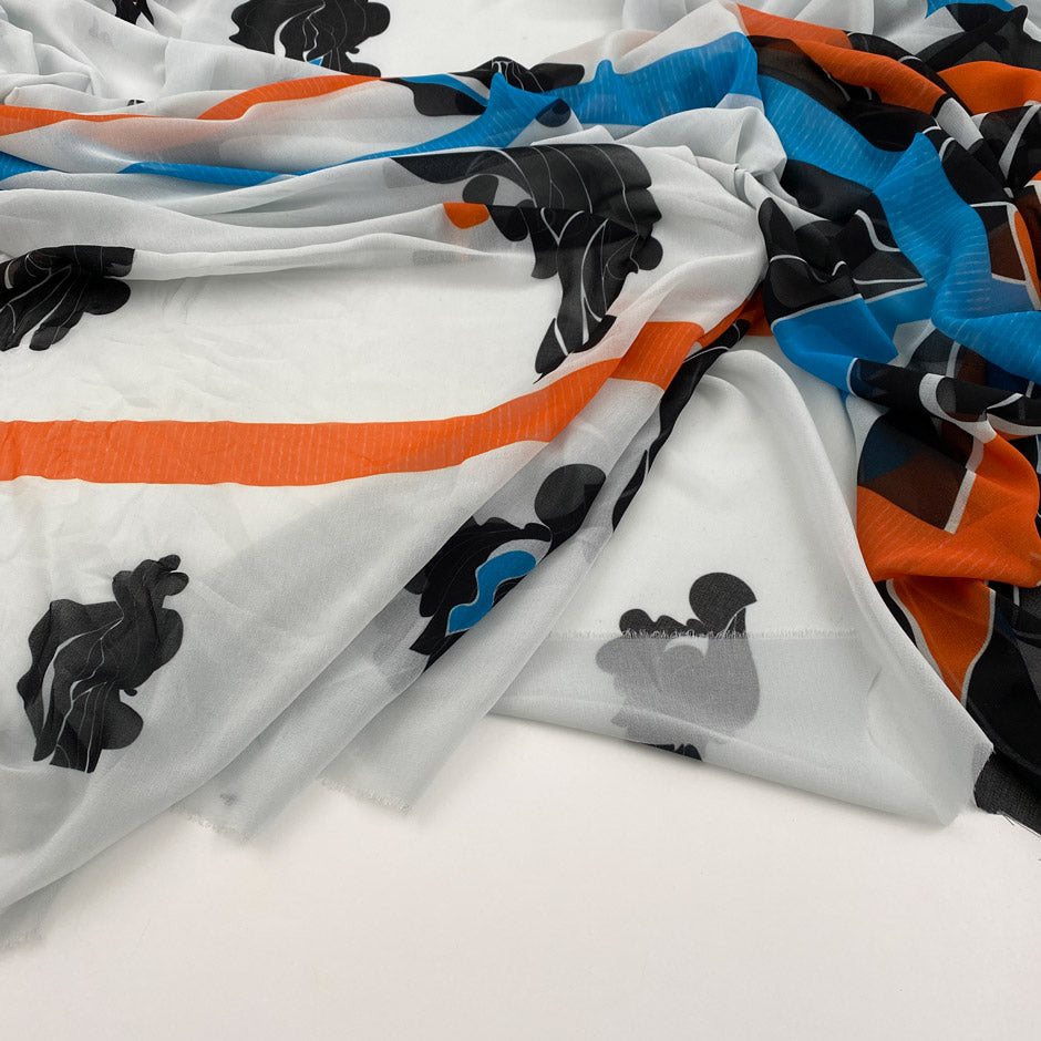 Printed polyester voile worked with soft transparent fluid crepe