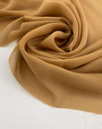 Flowing and drooping beige solid color silk georgette