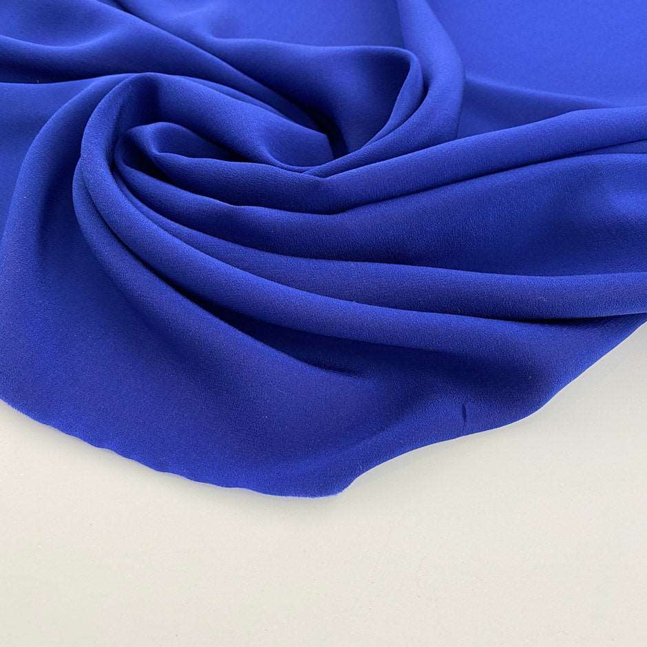 Flowing and drooping blue solid color silk georgette