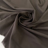 Dark brown polyester crepe, soft and fluid . Perfect dresses, skirts, blouses and shirts. High-quality deadstock collected in Stock from a Maison de Couture in Italy.