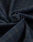 Punto Milano double-face viscose polyester. The fabric is squared printed, stretch, blue and black. High-quality deadstock collected in Stock from a Maison de Couture in Italy.