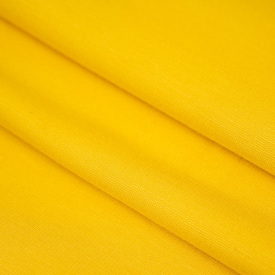 Yellow, stretchy jersey of viscose. High-quality deadstock fabric collected in Stock from a Maison de Couture in Italy.